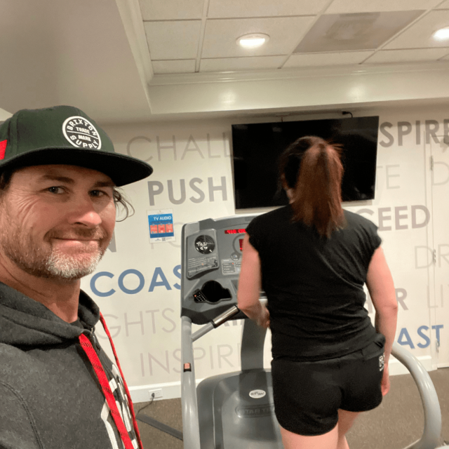 Best personal trainer San Diego is training a woman on a treadmill