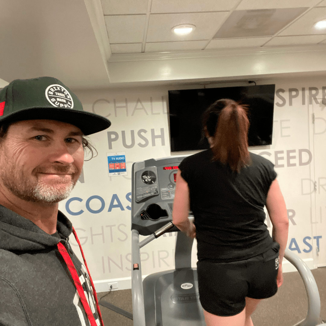 Best personal trainer San Diego is training a woman on a treadmill